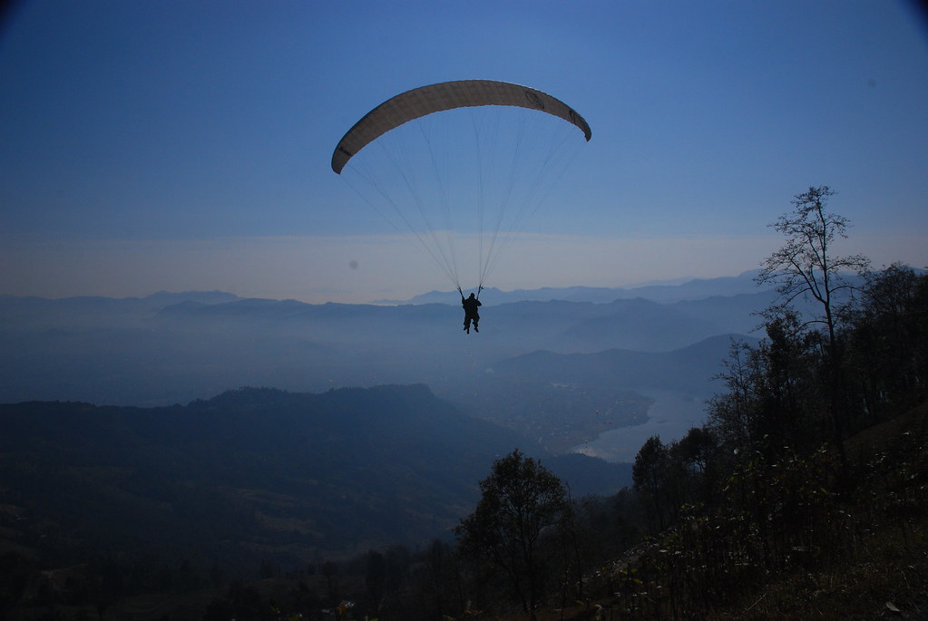 Paragliding above Pokhara. Photo: Vera & Jean-Christophe/Flickr